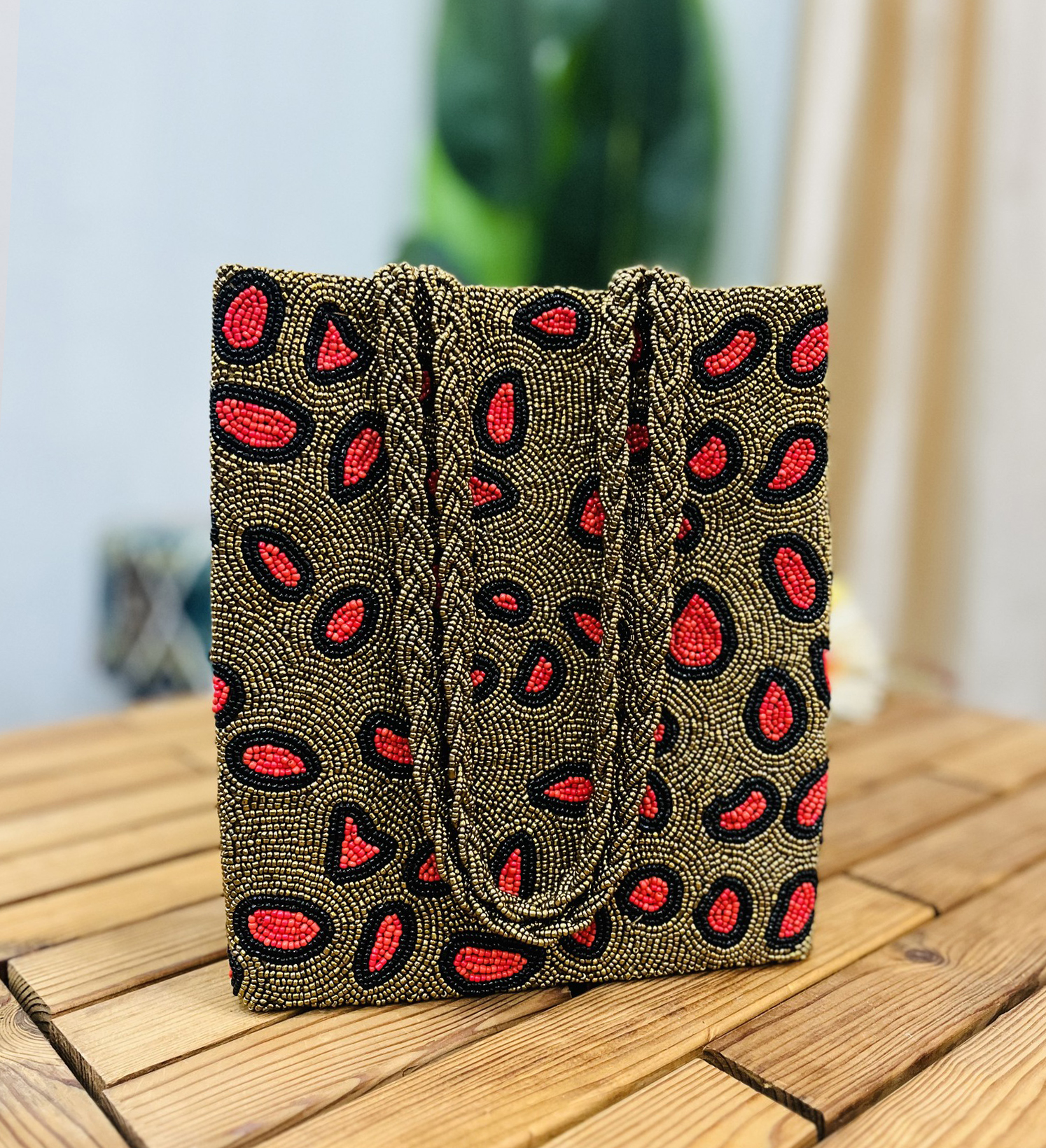 Hand-beaded tote bag with leopard print pattern, accented with colorful beads, featuring durable handles and a Zara label