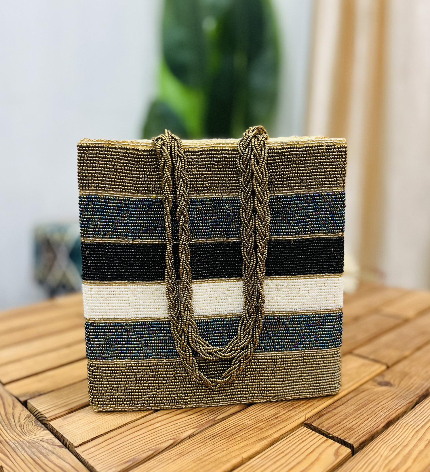 Metallic striped tote bag with hand-beaded design, featuring a mix of gold and silver beads, black handles, by Zara Label.