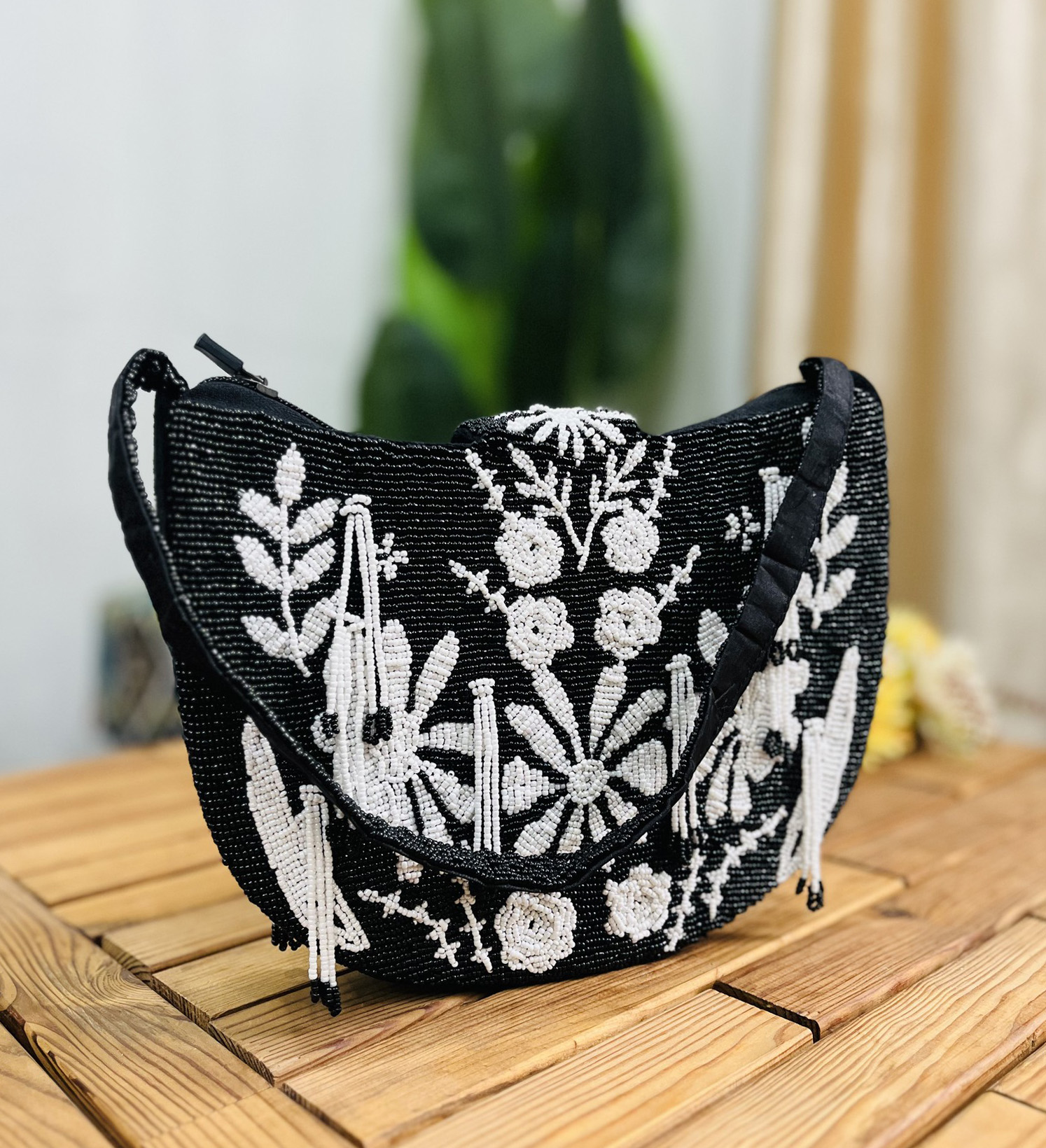 Monochrome floral patterned shoulder bag with intricate hand-beading; features a strap and branded by Zara.